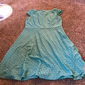Mid length, turquoise dress.